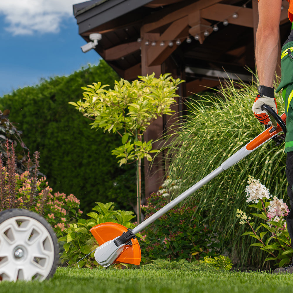 Strimming the lawn edges for a neat boundary
